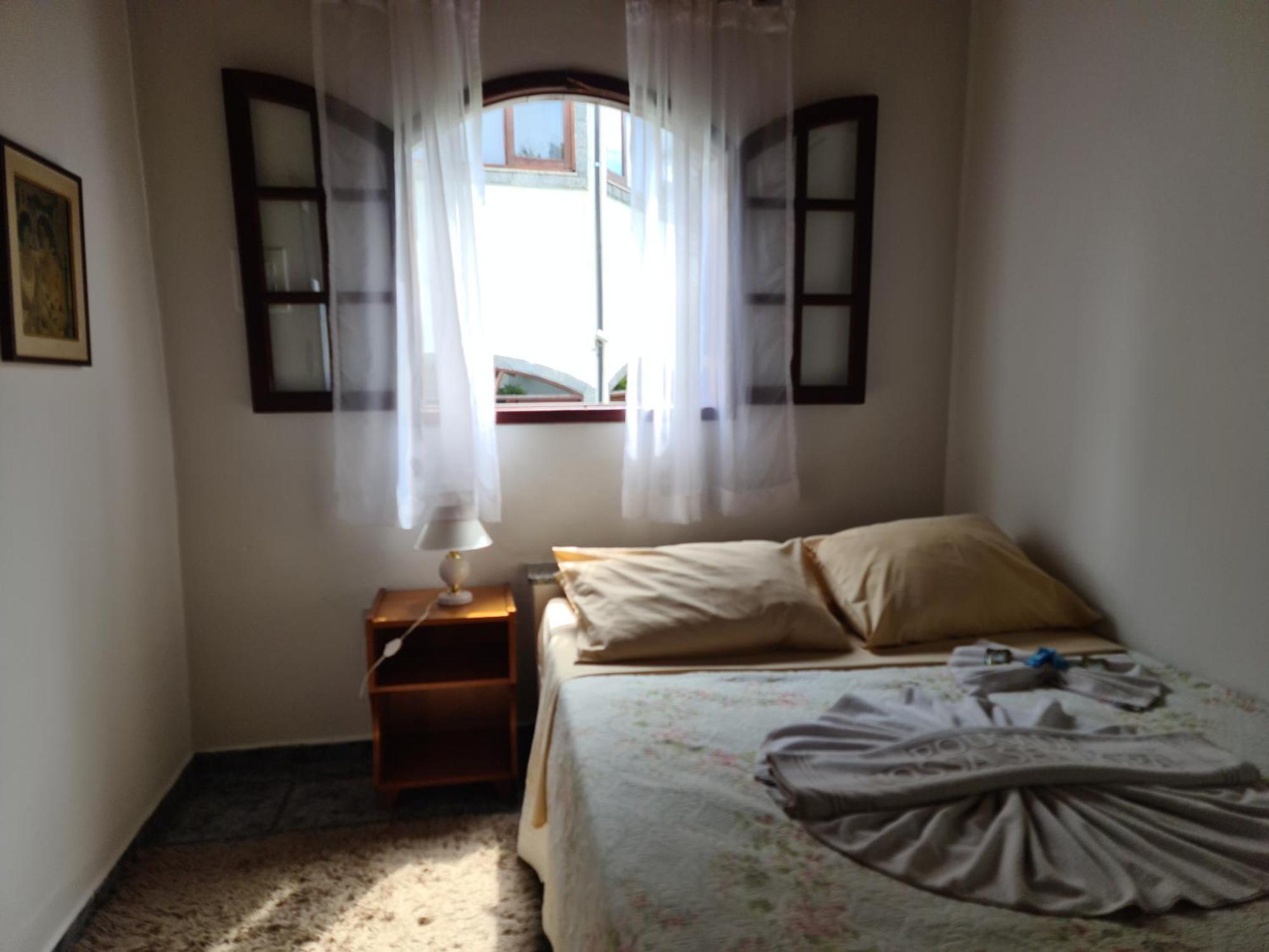 Pousada Nossa Senhora Penedo  Phòng bức ảnh A bedroom in a hotel in Brazil