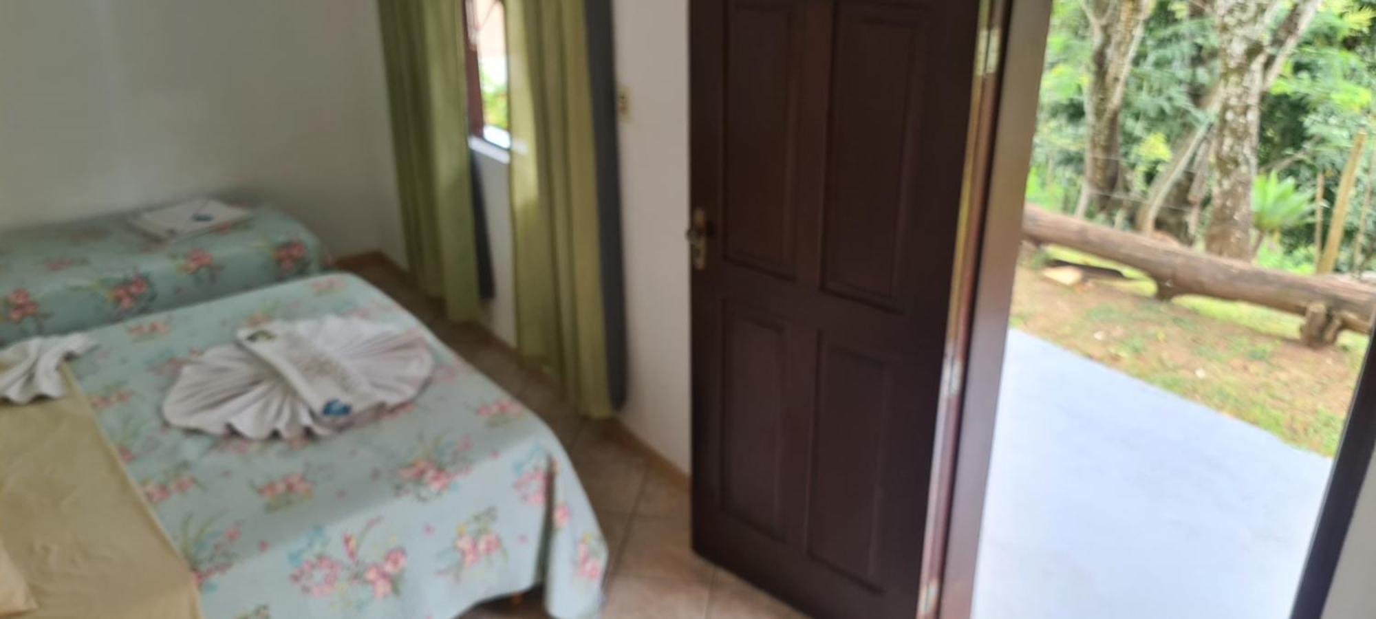 Pousada Nossa Senhora Penedo  Phòng bức ảnh A bedroom in a house in Brazil